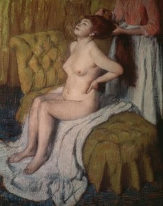 A Woman Having Her Hair Combed